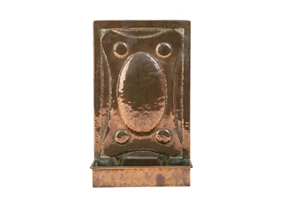 Lot 176 - An Arts and Crafts copper double candle sconce.