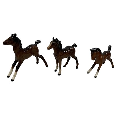Lot 30 - Three Beswick Bay Foal ornaments. The largest...