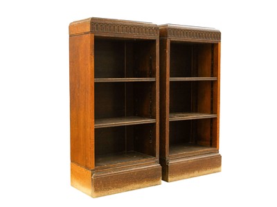 Lot 911 - A pair of oak dwarf bookcases.