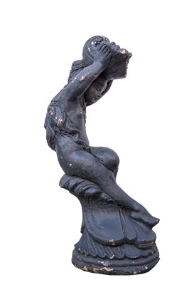 Lot 755 - A black painted cast stone water feature, modelled as a female holding a shell aloft.