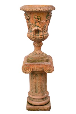 Lot 767 - A terracotta coloured urn of campana form with classical figural decoration.