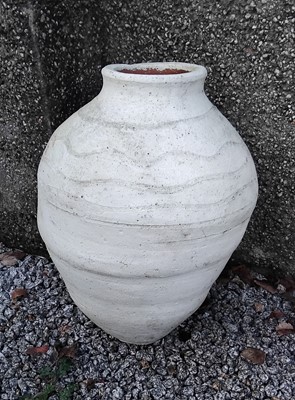 Lot 862 - A white painted terracotta olive jar.