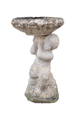 Lot 749 - A reconstituted stone bird bath.