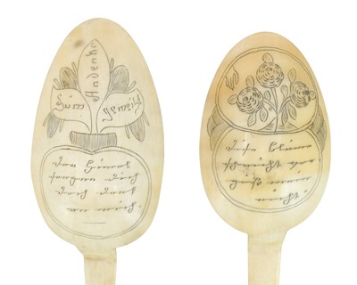Lot 76 - Two German horn love spoons.