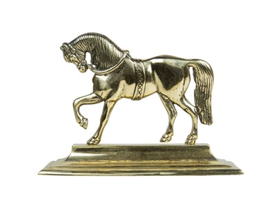 Lot 775 - A Victorian brass doorstop.