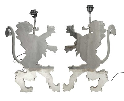 Lot 95 - A pair of bespoke lion passant nickel table lamps.