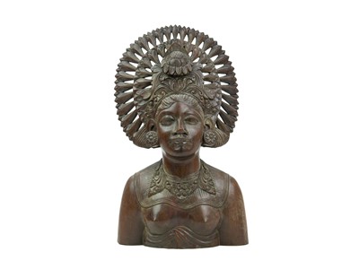 Lot 411 - A Balinese carved hardwood female bust.
