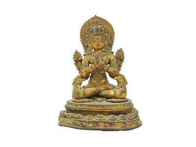 Lot 389 - A Tibetan gilt bronze figure of Tara Buddha.