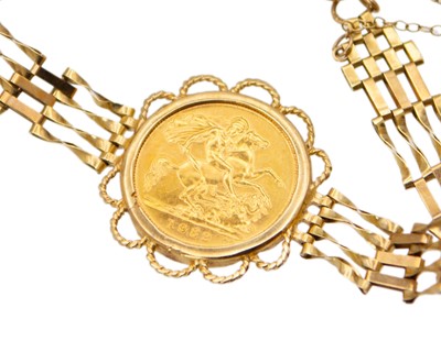 Lot 168 - A half sovereign set in a 9k gold bar bracelet with a padlock clasp.