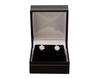 Lot 175 - A good pair of 18k white gold 1.40ct diamond solitaire stud earrings.