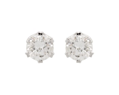 Lot 175 - A good pair of 18k white gold 1.40ct diamond solitaire stud earrings.