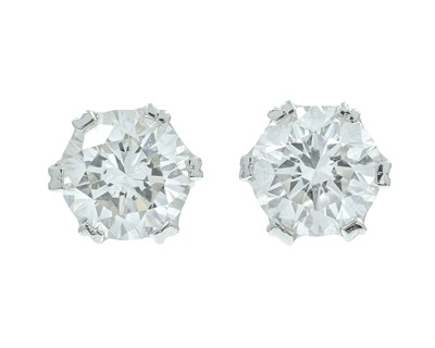 Lot 275 - A good pair of 18k white gold 1.40ct diamond solitaire stud earrings.