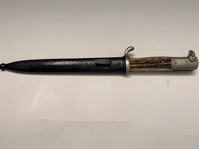 Lot 356 - A Henckels German short bayonet with deer horn...