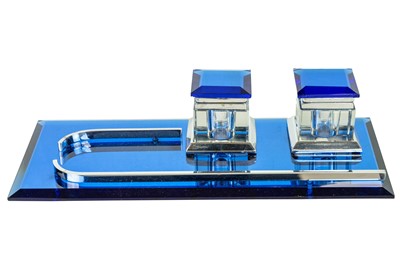 Lot 738 - A blue mirrored glass and chrome desk stand.