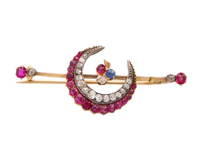 Lot 205 - A good Victorian ruby, diamond, and sapphire crescent bar brooch set in gold.