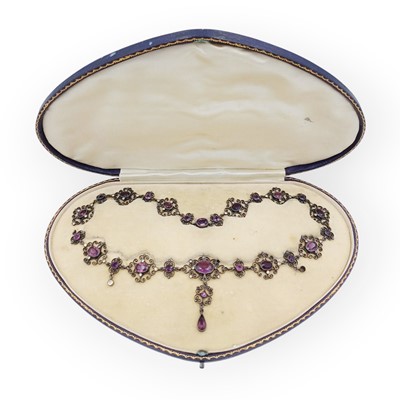 Lot 21 - A white metal paste set filigree pendant necklace in original box.