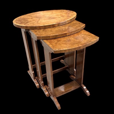 Lot 85 - A nest of three, quarter-cut side tables, the...