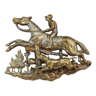 Lot 20 - A silver cast and pierced horse, hunter and hound brooch.