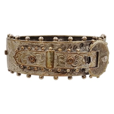 Lot 23 - A Victorian silver hinged buckle bangle.