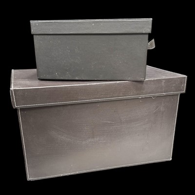 Lot 107 - Two faux leather storage boxes, the larger one...