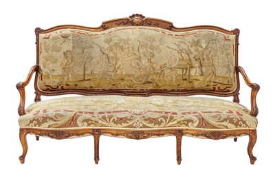 Lot 930 - A Louis XV style walnut framed settee.
