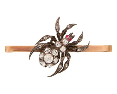 Lot 183 - A 9k gold, silver, and paste spider bar brooch, boxed.