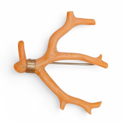 Lot 5 - A gold set pink coral branch brooch.
