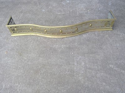 Lot 125 - A Brass Fender. The Fender is 132cm wide by...