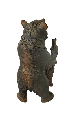 Lot 36 - A Black Forest carved bear tobacco jar.