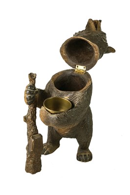 Lot 36 - A Black Forest carved bear tobacco jar.