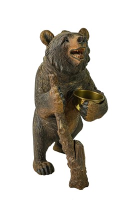 Lot 36 - A Black Forest carved bear tobacco jar.