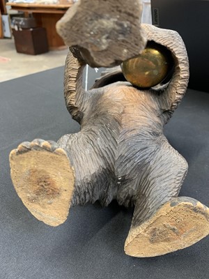 Lot 36 - A Black Forest carved bear tobacco jar.