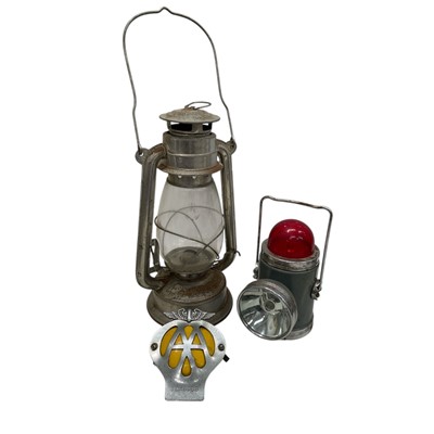 Lot 140 - A Vintage AA car badge, a Hurricane lamp and a...