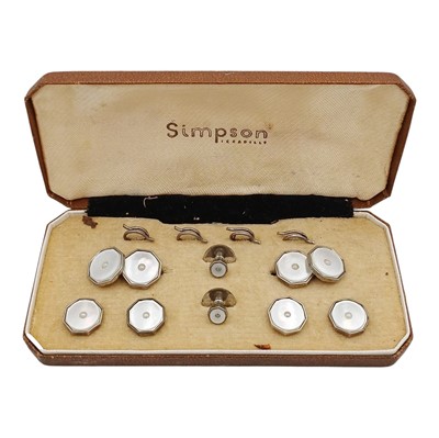 Lot 24 - A silver with a mother-of-pearl shirt button and cufflink dress set in an original box.