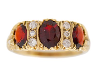 Lot 196 - A Victorian style 9k gold garnet and diamond ring.