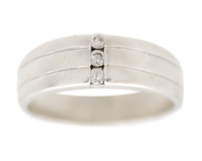 Lot 186 - A 9k white gold and diamond set three-stone gents band ring.