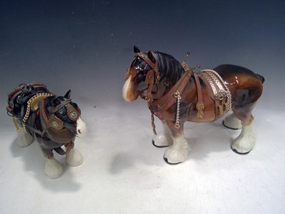 Lot 196 - Two Ceramic Shire Horses. The Large Horse is...