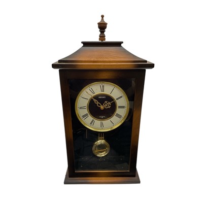 Lot 4 - A Vintage Seiko Quartz wall clock with a chime...