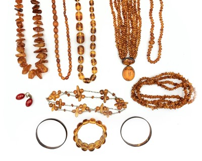 Lot 34 - A selection of amber jewellery items.