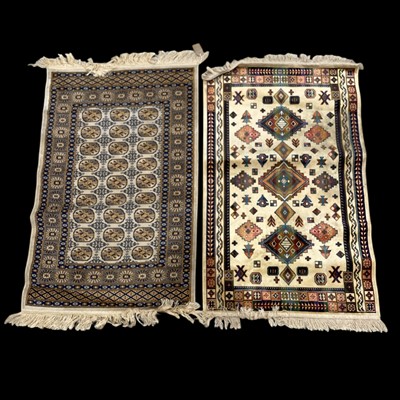 Lot 37 - Two good quality silk rugs, 110cm x 67cm.