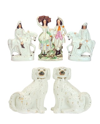 Lot 582 - A pair of Victorian Staffordshire spaniel ornaments.