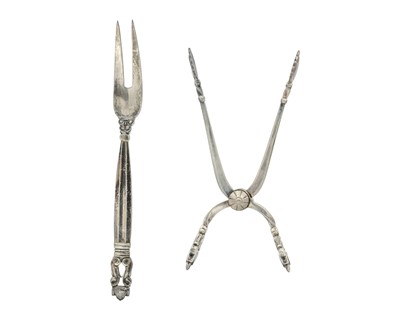 Lot 122 - GEORG JENSEN - A sterling silver pair of tongs and a pickle fork, cased.
