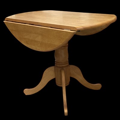 Lot 97 - A pine drop-leaf kitchen table, 92cm in diameter.