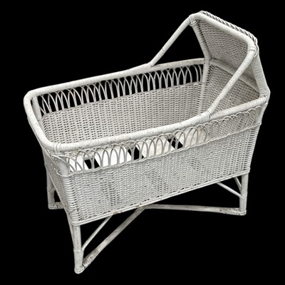Lot 99 - A painted wicker baby bassinet/crib, 84cm long.