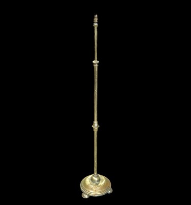 Lot 110 - A rise and fall brass standard lamp will...