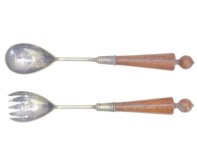 Lot 70 - An oak salad bowl with silver plated metal mounts and twin handles.