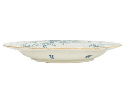 Lot 776 - A blue and white English Delft charger.