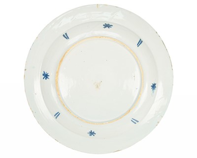 Lot 776 - A blue and white English Delft charger.
