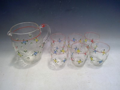 Lot 129 - A Hand Painted Water Set. The Jug is 17cm tall.
