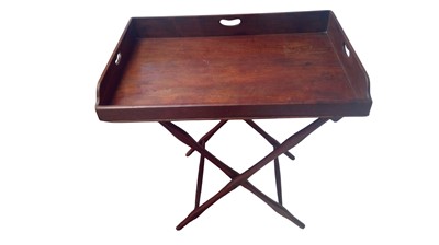 Lot 924 - A 19th century mahogany butler's tray on folding stand.